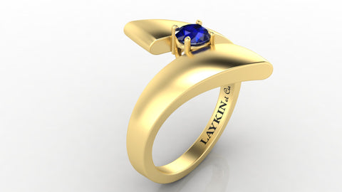 sapphire and 18 karat yellow gold bypass ring