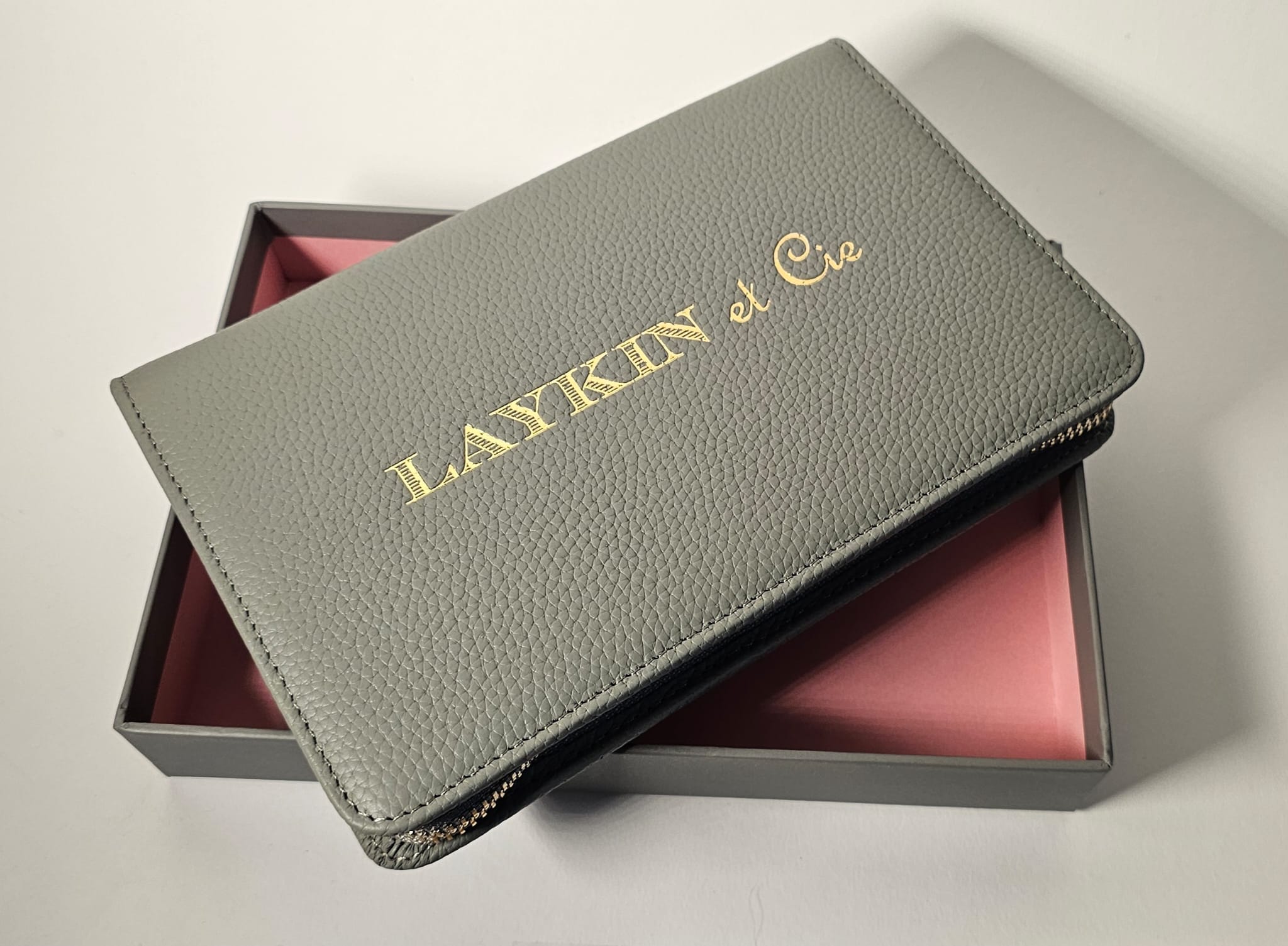 The Laykin Leather Valise in its gift box — gray pebbled leather with gold Laykin et Cie embossing
